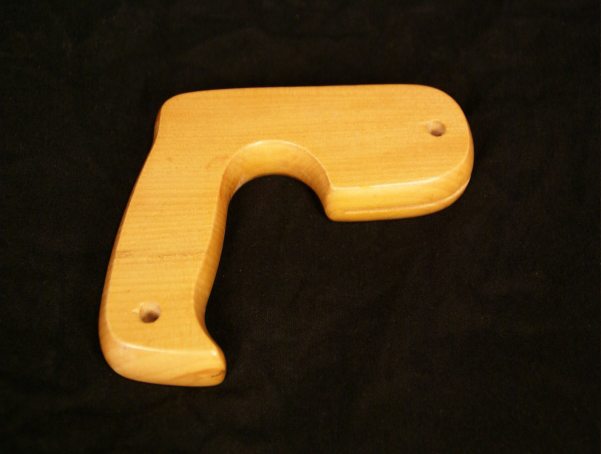 One wooden saw handle with slot and drill holes to secure saw blade.